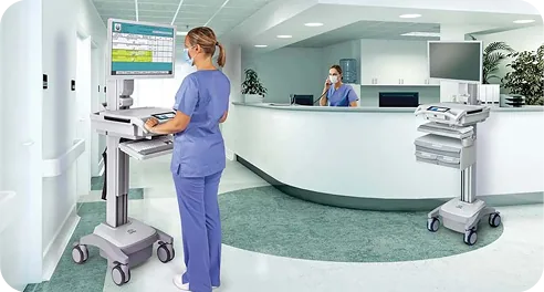 Nurse using a hospital-grade computer cart at the nurses' station