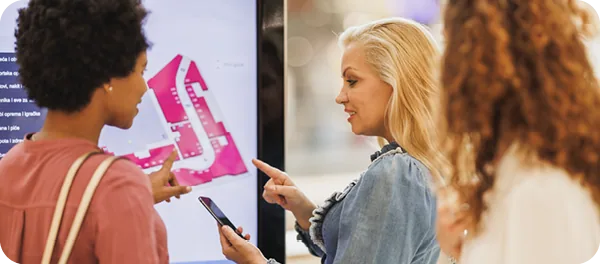 People use an interactive digital wayfinding display